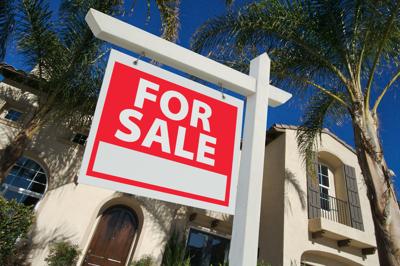 Sold Home For Sale Sign and New House (copy)