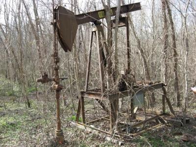 Abandoned well and pumping mechanism